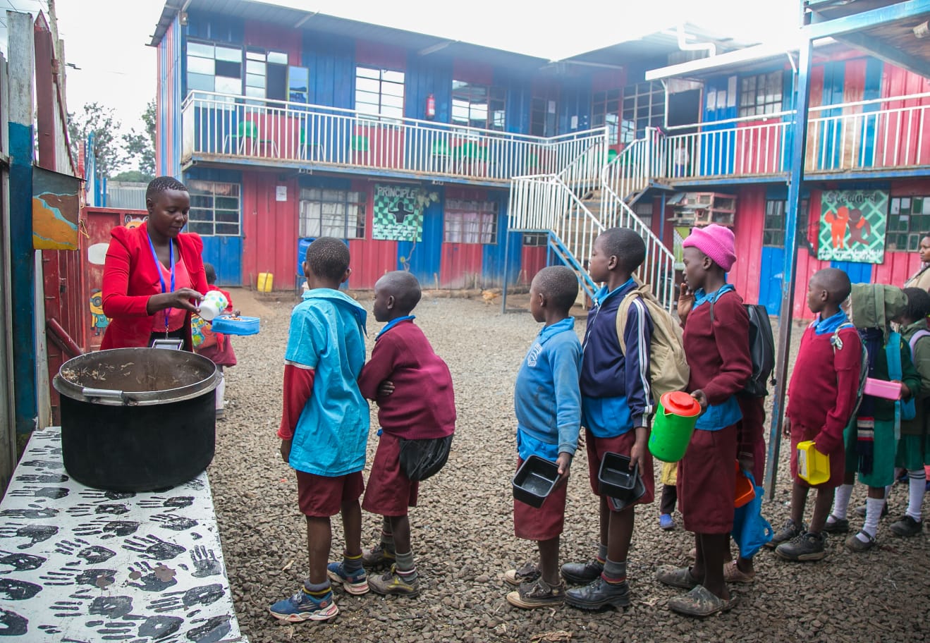 Children being served food at school